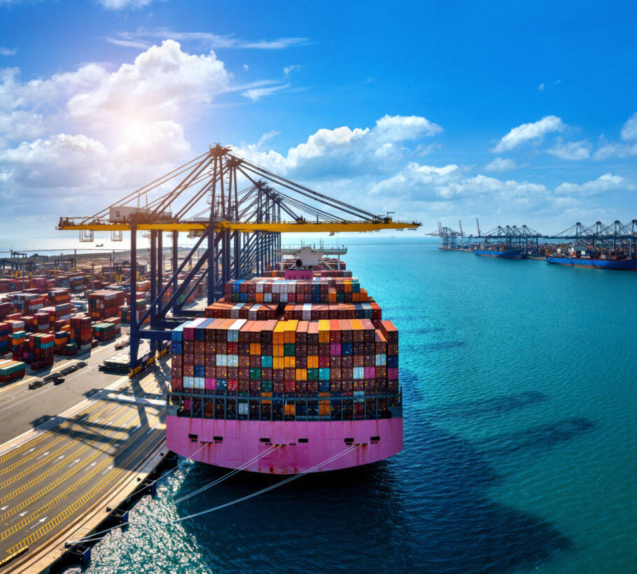 Aerial view of cargo ship and cargo container in harbor. Aerial view of cargo ship and cargo container in harbor.